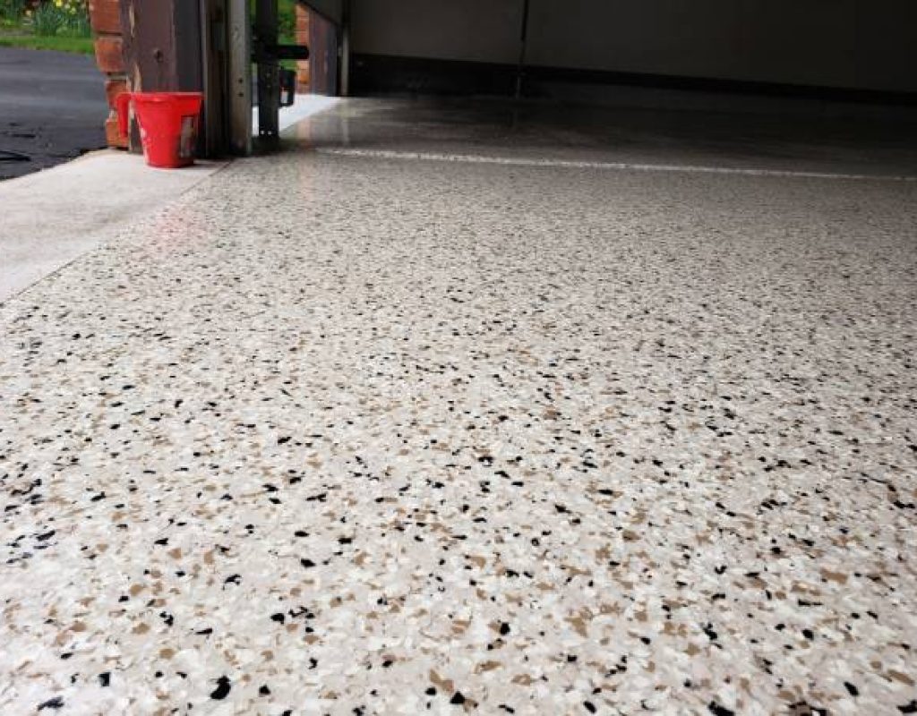 Close-up of metallic epoxy floor with custom finish installed in Hammock Beach
